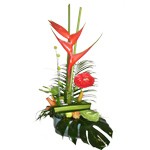 Assemblage �lanc� de fleurs exotiques dans son �l�ment d�coratif.
Il peut �tre r�alis� avec d autres fleurs et de coloris diff�rents.
Contenant non contractuel.