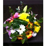 Bouquet rond de germinis dans les tons blanc, orange et une touche de rose